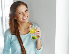 woman drinking infused water
